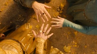 A screenshot of the three elven rings on Gil-galad, Cirdan, and Galadriel's middle fingers in The Rings of Power season 2