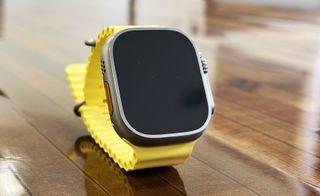 Apple Watch Ultra in use on wrist and on table