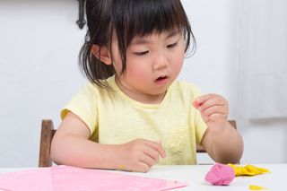 a young asian girl at school.