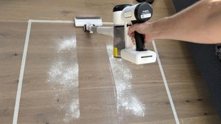 vacuuming flour on wooden floor