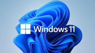 Windows 11 logo in front of the new wallpaper