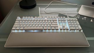 A Razer Pro Type Ultra on a glass-top desk