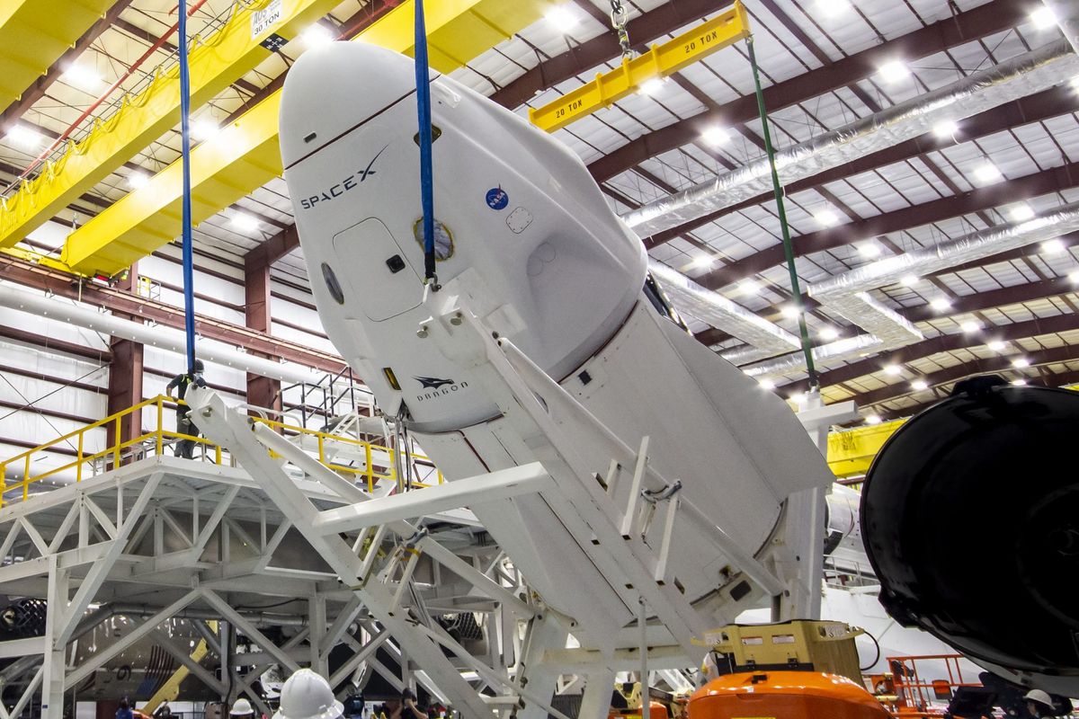 The Crew Dragon &quot;Endeavour&quot; is lifted and mated to its Falcon 9 rocket at NASA Kennedy Space Center’s Launch Complex 39A , on April 13, 2021. 