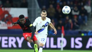 Karim Konate of Salzburg chases the ball ahead of the Real Sociedad vs RB Salzburg match