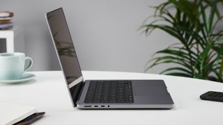 MacBook Pro 14-inch on a table in an office