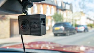 The Garmin Dash Cam Tandem mounted in a windshield