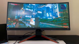 BenQ Mobiuz EX3415R on a gaming desk