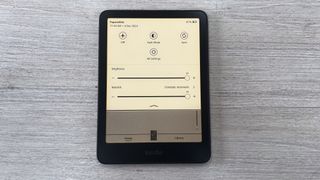 The brightness and light temperature sliders on the Amazon Kindle Paperwhite (2024) set at maximum