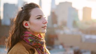 Woman wearing Waverly Labs earpiece