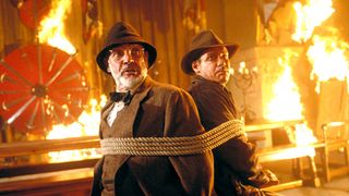 Sean Connery and Harrison Ford are tied up in a fiery room in Indiana Jones and the Last Crusade