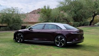 Angled side view of car parked on grass