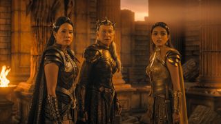 Hespera, Kalypso, and Anthea turn around to look at something off-camera in Shazam! Fury of the Gods