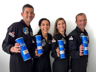 Polaris Dawn crew members with Doritos Cool Ranch Zero Gravity canisters. From left to right: commander Jared Isaacman, mission specialists Sarah Gillis and Anna Menon and pilot Scott "Kidd" Poteet.