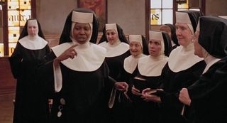 Whoopi Goldberg as Sister Mary Clarence, talking to a group of nuns in the movie Sister Act.