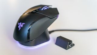 Razer Basilisk V3 Pro with Mouse Dock Pro on a white table