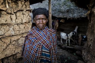 I was in a mountain village, where I meet a woman outside her house. She is beautiful and it important for the balance in the portrait, that the goat is in the lower right corner