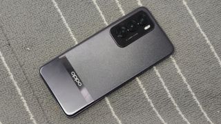 The Oppo Reno 12 Pro on a gray and white background.