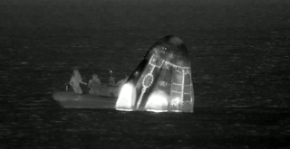 The recovery team check the Polaris Dawn Capsule