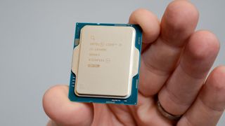 A hand holding an Intel Core i5-14600K