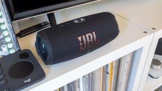 JBL Charge 5 on a shelf in a home