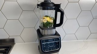 The Ninja Foodi Blender & Soup Maker HB150UK being used to make a smoothie