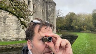 man using a monocular