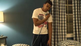 Mekai Curtis as Kanan Stark takes a phone call in Power Book III: Raising Kanan season 3