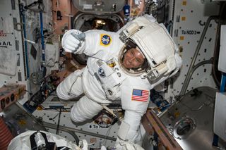 NASA astronaut Jack Fischer gives a thumb's up while wearing an extravehicular mobility unit (EMU) spacesuit ahead of a May 12, 2017 spacewalk at the International Space Station. Fischer and NASA astronaut Peggy Whitson will conduct a repair spacewalk on