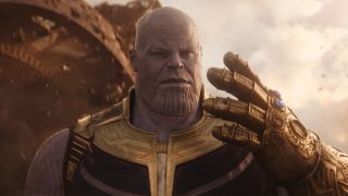 Marvel Timeline: Thanos looking at the Infinity Gauntlet during Avengers Infinity War.