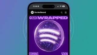 A phone on a violet and green background showing a Spotify Wrapped 2024 teaser