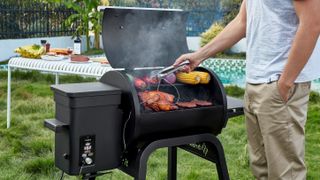 The Brisk It Zelos-450 being used to grill chicken, and veggies (onions, bepper, sweetcorn)