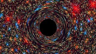 This computer-simulated image shows a supermassive black hole at the core of a galaxy.