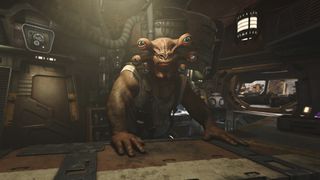 An alien stands at a bar in a cantina. He has six eyes and orange skin, tattoos on his arms