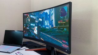 BenQ Mobiuz EX3415R on a gaming desk