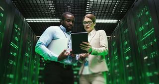 Woman and man in a server room