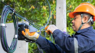 Technician working on fiber optic cable