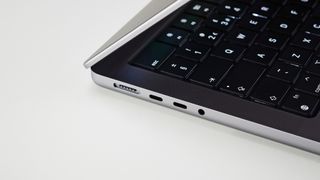 MacBook Pro 14-inch on a table in an office focusing on the ports