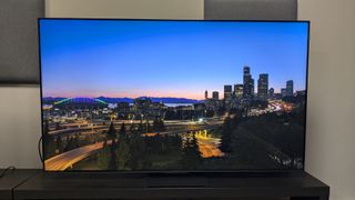 TCL C855 with landscape at dusk on screen