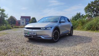 Front-on, at an angle, view of Ioniq in gravel parking lot