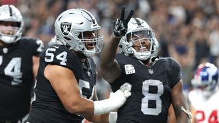 Josh Jacobs #8 of the Las Vegas Raiders celebrates with Netane Muti #54 ahead of the Raiders vs Dolphins live stream