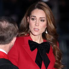 Kate Middleton in a red ensemble at the fourth annual "Together at Christmas" carol service at Westminster Abbey. 