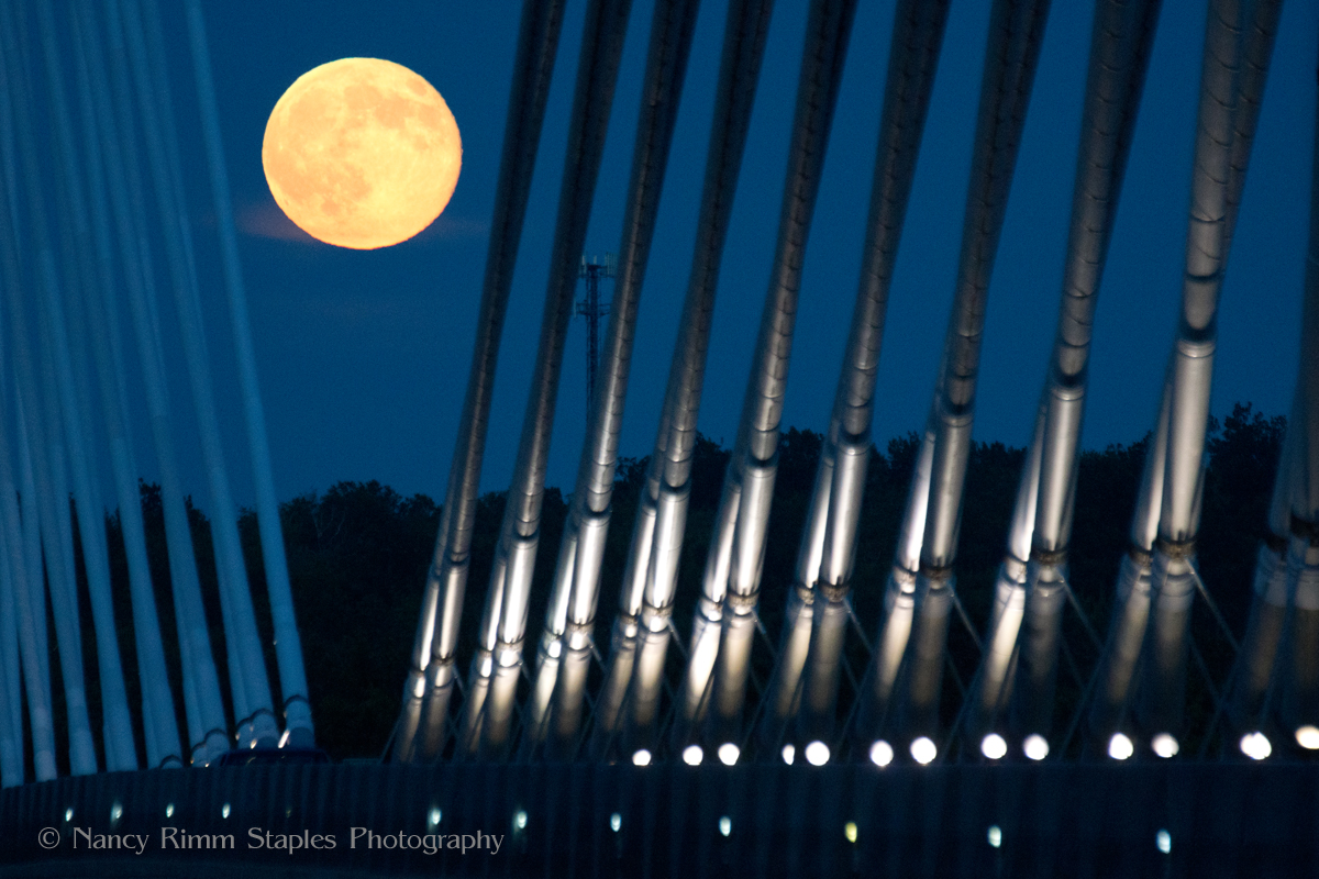 The &quot;supermoon&quot; full moon of July 12, 2014 is seen over Penobscot Narrows Bridge linking Prospect, Maine with Verona Island. Two more supermoon full moons will follow on Aug. 10 and Sept. 9. 