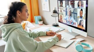 college student using an iMac computer for studying