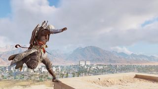 Assassin's Creed Origins screenshot of Bayek parkouring across the dessert