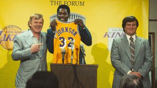 Magic Johnson (Quincy Isaiah), Doctor Buss (John C. Reilly) and Jerry West (Jason Clarke) at Magic's jersey presentation in Winning Time: The Rise of the Laker's Dynasty