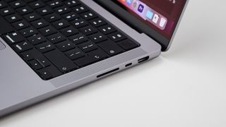 MacBook Pro 14-inch on a table in an office focusing on the ports