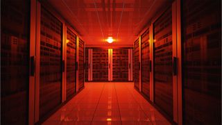 Data center blackout concept image showing server room with red lighting signifying downtime during cloud outages. 