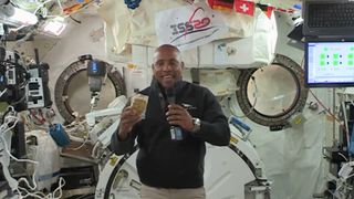 NASA astronaut Victor Glover showcases some cornbread dressing on the International Space Station, part of the Expedition 64 crew's Thanksgiving dinner, in a video of the astronauts' holiday meal.