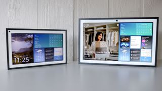 The original Echo Show 15 and the new Echo Show 21 side by side on a table with their screens on