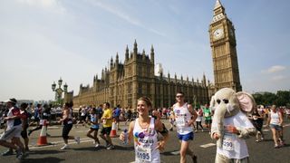 Fun runners competing in the London Marathon outside the Houses of Parliament